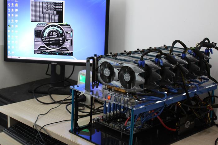 A cryptocurrency miner examining a mining rig, highlighting the technical expertise required