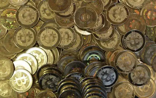 A vast mining farm with rows of mining rigs